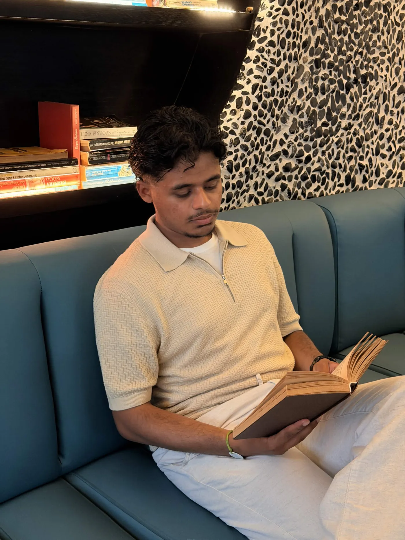 Hasan reading a book