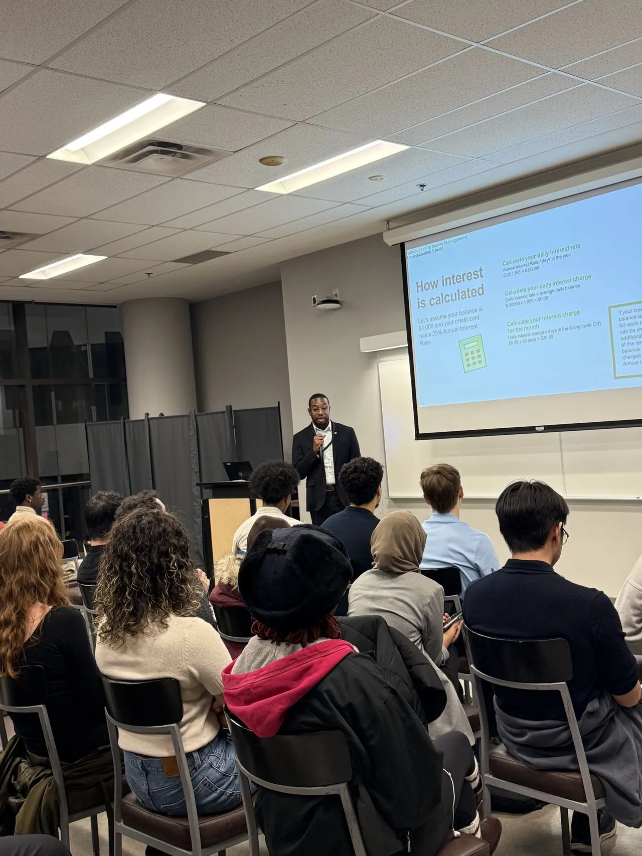 Speaker presenting 'How interest is calculated' at the BBSA event